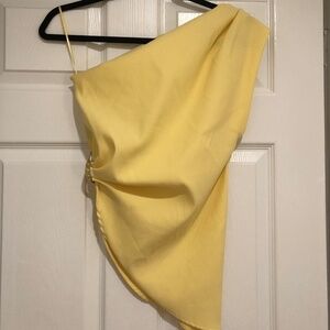 Woman’s Zara butter yellow one shoulder top. Asymmetrical cut.